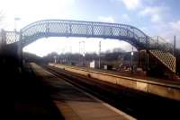 Looking north through Auchinleck station on 26 March 2015. When Auchinleck reopened in 1984, the footbridge came from Crookston, which had closed the previous year. Crookston itself reopened in 1990 but as a single-platform station.<br><br>[John Yellowlees 26/03/2015]
