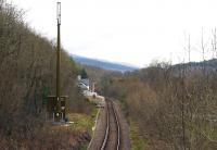 Looking southeast towards Pont-y-Pant from the approach lane overbridge in April 2015. The station had a passing loop until 1951 and also a siding along the line of the present cable duct, but only had a single platform. When the scene is observed from other viewpoints the radio mast and cabin are less obtrusive than appears here.<br><br>[Colin McDonald 14/04/2015]
