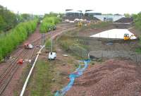 A hive of activity in the area around Newcraighall South Junction on Sunday morning 10 May 2015. View is south, showing work taking place in several locations at the northern end of the Borders Railway, not least on the new bridge that will eventually carry the link from Whitehill Road into the recycling plant.<br><br>[John Furnevel 10/05/2015]