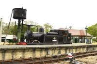Scene on the Isle of Wight Steam Railway at Haven Street on 9 May 2015. The locomotive is Adams O2 0-4-4T W24 <I>Calbourne</I>, masquerading on this occasion as W33 <I>Bembridge</I>. [See image 23635] <br><br>[Peter Todd 09/05/2015]