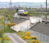 The 1023 Edinburgh - Helensburgh service approaching the Armadale stop on 15 May 2015. The town of Bathgate occupies most of the background. <br><br>[John Furnevel 15/05/2015]