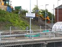 Work underway on the steps which will provide a pedestrian link between the A7 and the new Borders Railway station at Newtongrange. Looking south east across the line on 3 June 2015.<br><br>[John Furnevel 03/06/2015]