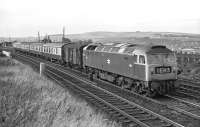 With only four Mk 1 coaches and a Southern Railway PMV in tow, Brush Type 4 No. 1513 is already making good speed following the Berwick stop as it passes through Tweedmouth in 1970. The train is the 14:15 Edinburgh to Newcastle semi-fast, or perhaps semi-slow as it had already taken 90 minutes to get this far! The rear end of the 09:20 York to Edinburgh parcels, which had passed two minutes previously [see image 50958], can just be discerned on the Royal Border Bridge.<br><br>[Bill Jamieson 19/09/1970]