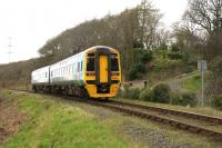 A mid-day service from Birmingham International to Pwlhelli accelerates up the gradient towards Minffordd on 13th April 2015.<br><br>[Colin McDonald 13/04/2015]