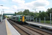 Opened in 2013, Stratford-upon-Avon Parkway still has a brand new feel about it two years later. 172337 makes its first stop on a London Midland Stratford-upon-Avon to Stourbridge Junction service on 15th June 2015. <br><br>[Mark Bartlett 15/06/2015]