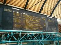 Nowadays, visual departure information at stations is standardised with almost all coming from the same company, infotec.co.uk. In the past though there was more variety. This board at Newcastle Central in June 1997 is electro-mechanical dot-matrix, with no light source of its own and reads along the way, rather than 'menu-style' which is now the norm. The method of denoting buffet and restaurant services using number of blocks seems a little eccentric. Wouldn't it have been clearer just to say 'BUFFET' or 'RESTAURANT'?<br><br>[David Panton 19/06/1997]