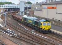 Freightliner 66595 passing through Perth station on 28 June 2015 with a Carmont - Millerhill ballast train.<br><br>[Bill Roberton 28/06/2015]