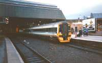 In February 1998, as the light starts to fade, a class 158 calls at the little-used Platform 3 at Perth with an Inverness to Edinburgh service. <br><br>[David Panton /02/1998]