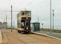 Bolton 66, a regular performer on Heritage services in Blackpool since 1981, climbs past the Cliffs Hotel stop between Gynn Square and the Cabin in May 2015. It ran in Bolton from 1901 to 1946, spent time in use as a summer house and then <I>chicken hut</I> but was purchased by the Bolton 66 Trust in 1963 and restored.<br><br>[Mark Bartlett 24/05/2015]