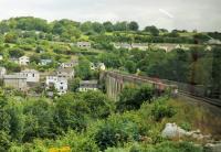 View of the famous Calstock viaduct from the left hand window of a Gunnislake bound Sprinter cautiously rounding the approach curve on the Devon side. The Tamar river is the county boundary and Calstock village in Cornwall can be seen on the far side of the bridge.<br><br>[Mark Bartlett 29/07/2015]