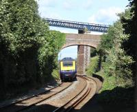 A FGW Plymouth to Paddington HST hurries through Teignmouth and onto the coastal line to Dawlish and Exeter. The further of the two over bridges seen here features in many lineside photographs at Teignmouth but usually from the sea wall [See image 43852] <br><br>[Mark Bartlett 29/07/2015]