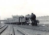 An unidentified Gresley V1 seen shortly after leaving Shettleston station with a Hyndland - Easterhouse service in April 1958. The train is passing Shettleston Junction, with the NB route to Bothwell and Hamilton turning south [see image 35603].<br><br>[G H Robin collection by courtesy of the Mitchell Library, Glasgow 28/04/1958]
