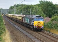 DRS 57301 hauling a <I>Northern Belle</I> service from Warrington to Edinburgh on 15 August 2015, seen here shortly after passing the site of Boars Head Junction.<br><br>[John McIntyre 15/08/2015]