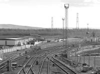 View south at Millerhill in March 1987 with the main yard behind the camera. The Bilston Glen branch bears right and the new ECML Electrification Depot is taking shape on the left.<br>
<br><br>[Bill Roberton 18/03/1987]