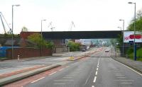 Looking east along the A8 in Greenock towards Glasgow in April 2007, showing the lengthy Caledonian Railway bridge that carried the line over the road and into James Watt Dock on the left.  [See image 15506]  <br><br>[John Furnevel 29/04/2007]