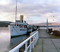 The PS <i>Maid of the Loch</i> at Balloch Pier after closure of the station but before lifting of the line. The removed overhead equipment between the Pier and Central stations at Balloch was used to electrify the line between Whifflet to Coatbridge Sunnyside.<br><br>[Ewan Crawford //1987]
