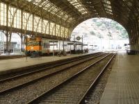 Looking north through the overall barrel roofed trainshed at Portbou in August 2015, with a Renfe Rodalies de Catalunya EMU seen stabled at platform 4.<br><br>[David Pesterfield 07/08/2015]
