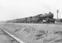 An interesting looking freight heading towards Glagow past Clydebank East Junction on 12 April 1958. Locomotive is Gresley K4 2-6-0 no 61996 <I>Lord of the Isles</I>. [See image 50724]<br><br>[G H Robin collection by courtesy of the Mitchell Library, Glasgow 12/04/1958]