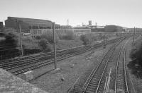View over Milnwood / Mossend South Junction with lines diverging to Holytown, Coatbridge Central and Bellshill. In the background is British Steel Tubes division's Clydesdale Mill. A further line in the 'V' of the junction served Mossend Yard's down yard.<br><br>[Bill Roberton 01/05/1991]