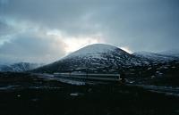 New Year's Eve, 1994/5. Under a snow laden sky a northbound train passes Druimuachdar Summit. It was really too late in the day for photographing moving trains!<br><br>[Ewan Crawford 31/12/1994]