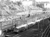 Looking east from a point above Primrose Hill tunnel on 12 September 1969. Emerging from the dive-under on the slow lines from Euston is a class 310 EMU operating an outer suburban service to Northampton. The WCML fast lines are just visible on the right, while over on the left is the through freight-only link to Camden Road and the North London Line.<br><br>[John Furnevel 12/09/1969]