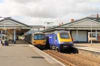 Pacer 143603, on a local service for Paignton, meets a Paddington bound HST at Newton Abbott station. 43009 is leading the London service and, on the far left, another Pacer can just be seen waiting to go forward to Exeter and Exmouth once the express has departed. <br><br>[Mark Bartlett 29/07/2015]