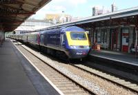 First Great Western 43015 speeds through Teignmouth at the head of a Paddington to Penzance express on 29th July 2015. <br><br>[Mark Bartlett 29/07/2015]