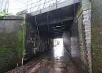 The bridge over the minor road to the north of St Boswells station originally carried two tracks and was extended on the east side as the goods yard, serving a large market, expanded. The view looks west.<br><br>[Ewan Crawford 26/12/2015]