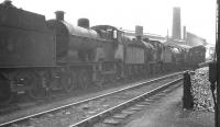 Shed scene at Nottingham (16A) on 13 May 1961. Amongst the locomotives awaiting disposal is class 2P 4-4-0 no 40557, withdrawn from here some 2 months earlier.  <br><br>[K A Gray 13/05/1961]