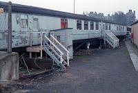 Two LNER teak bodied carriages at Perth's carriage sidings in departmental use. Does anyone know more about them and their fate?<br><br>
Updates from replies:<br><br>
They were used as accommodation for the carriage cleaners and were remarkably intact. Fixtures such as LNE mirrors etc. survived.<br><br>
RB 24080 is now on the Great Central see <a target='external' href='http://www.rvp-ltd.org.uk/collection.php?vehicle=24080'>Railway Vehicle Preservations - RB 24080</a>.<br><br>
TTO 23981 is also on the Great Central see <a target='external' href='http://www.rvp-ltd.org.uk/collection.php?vehicle=23981'>Railway Vehicle Preservations - TTO 23981</a>.<br><br>
<br><br>[Ewan Crawford 07/11/1988]