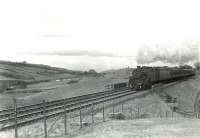 In the hills above Shilford on a spring afternoon in late March 1962. The train is the 5.12pm Glasgow Central - Uplawmoor and the locomotive is Fairburn 2-6-4 tank 42056.  <br><br>[G H Robin collection by courtesy of the Mitchell Library, Glasgow 30/03/1962]
