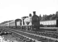 Scene in the sidings at Balloch on 9 July 1957, featuring Dawsholm shed's ex-Caledonian 3F 0-6-0 57554 with a train of empty stock.  <br><br>[G H Robin collection by courtesy of the Mitchell Library, Glasgow 09/07/1957]