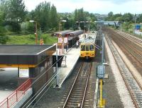 A Tyne & Wear Metro service destined for South Shields arrives at Pelaw station in the summer of 2004.<br><br>[John Furnevel 10/07/2004]