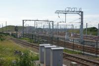 The new Hitachi maintenance facility for the Class 800 IEP trains at Stoke Gifford seen from a passing train between Filton Abbey Wood and Bristol Parkway on 21 June 2016. Whilst there are several sidings at this (east) end of the site, further west there is a large building offering covered facilities.<br><br>[John McIntyre 21/06/2016]
