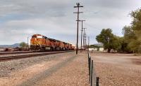 Five diesel locomotives working in multiple haul a seventy nine wagon train of double deck containers through Seligman, formerly a junction on the Santa Fe Railroad in Arizona. Photo by Mark Edwards 30th July 2016<br><br>[Mark Bartlett Collection 30/07/2016]