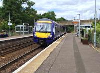 A Class 170 DMU approaches the 1985 Bridge of Allan station from Dunblane. There is a currently a TACTRAN proposal in development to relocate to station further south, nearer to Cornton and Causewayhead. <br><br>[Colin McDonald 01/08/2016]