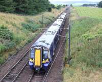 ScotRail 380110 heads north from Carstairs East Junction shortly after the Carstairs stop on 31 July 2016 with the 0831 Ayr - Edinburgh via Glasgow Central.<br><br>[John Furnevel 31/07/2016]