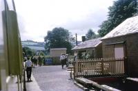 A train from Buckfastleigh calls at Staverton on the Dart Valley Railway on the afternoon of 30 July 1969. At that time the train continued south towards Totnes but there was neither access to the BR station, nor had the DVR built their own station at Totnes Riverside, so push-pull working was a distinct advantage.<br><br>[John McIntyre 30/07/1969]