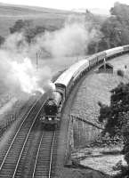 Train 1X75, the South & West Railway Society Euston – Aberdeen <I>Granite City</I>, approaching Bowshank Tunnel behind V2 60836 on 3 September 1966. Various locomotives were used during the trip, with 60836 handling the Carlisle – Edinburgh leg, following which A2 60532 <I>Blue Peter</I> took over for the journey to Aberdeen via the Glenfarg route [see image 20700]. The special returned south the following day via the ECML, terminating at Kings Cross.  <br><br>[Dougie Squance (Courtesy Bruce McCartney) 03/09/1966]