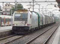 Renfe 253 064-0 passes Sant Vincenc de Calders with a southbound steel train on 14 October.<br><br>[Bill Roberton 14/10/2016]