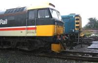 Preserved locomotives 47643 and 08443 stand in pouring rain in the yard at Bo'ness on 6 September 2006. <br><br>[John Furnevel 06/09/2006]