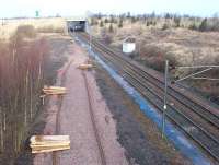 Track and sleepers ready to form a new turnback siding at the north end of Millerhill yard on 28 January 2002. The work was in preparation for the introduction of train services to the new station at Newcraighall,  at that time under construction just beyond the bridge. The new services commenced some 4 months later [see image 3430].<br><br>[John Furnevel 28/01/2002]