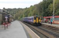 View from the Manchester platform at Todmorden as Northern 156420 slows to call with a Leeds service on 21st October 2016. <br><br>[Mark Bartlett 21/10/2016]