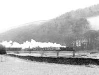 A goods train crossing the River Tweed at Cardrona heading for Innerleithen, thought to have been taken around 1960. The Peebles Loop closed completely in 1962.<br><br>[Dougie Squance (Courtesy Bruce McCartney) //1960]