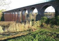 The 1863 railway viaduct at Leaderfoot, photographed looking north towards Earlston on 27 December 2016. Part of the 1973 road bridge that carries the A68 across the River Tweed can be seen through the arch on the right.<br><br>[John Furnevel 27/12/2016]