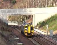 Less than half a mile north of Tynehead station, just prior to crossing the Tyne Water, the Borders Railway runs below a road bridge linking Halflawkiln Farm and the B6367. On the afternoon of 27 December 2016 ScotRail 158735 is seen here about to pass below the bridge with the 1259 Tweedbank – Edinburgh.   <br><br>[John Furnevel 27/12/2016]