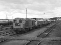 Passing stabled locos at Thornton Depot including 20202, 25066 and a couple of sisters. Seen from the Branch Line Society's Lothian & Fife Wanderer on 23 August 1980 which was returning from a visit to Westfield.<br><br>[Bill Roberton 23/08/1980]
