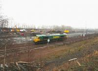 Sunday morning activity at Millerhill on 22 January 2017 as Freightliner 66551 ambles through the yard. Works in connection with the new ScotRail EMU depot are underway in the background, with the former locomotive servicing facilities having recently been removed.<br><br>[John Furnevel 22/01/2017]