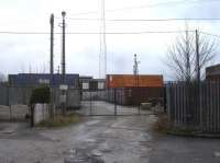 Looking towards the entrance into the former Shirebrook diesel maintenance depot in February 2017, with some of the numerous stored shipping containers that occupy the area around the building lining the access road. Other than the containers nothing else seems to have changed on site since closure.<br><br>[David Pesterfield 08/02/2017]