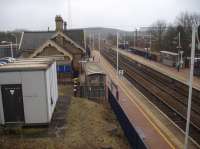 A view south over the now re-opened Shirebrook station, from a near identical position to one taken nearly 37 years earlier in 1980 [see image 4783]. As can be seen the former down side stone built building has given way to a minimalist shelter, but the main up side station building is still intact, although now in use as a business centre.<br><br>[David Pesterfield 08/02/2017]